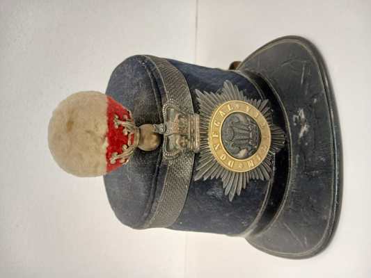 Shako Cap from Donegal Militia Collection. These caps were popular among local militia and British Army regiments throughout the 19th century. (DCM.2025.57)